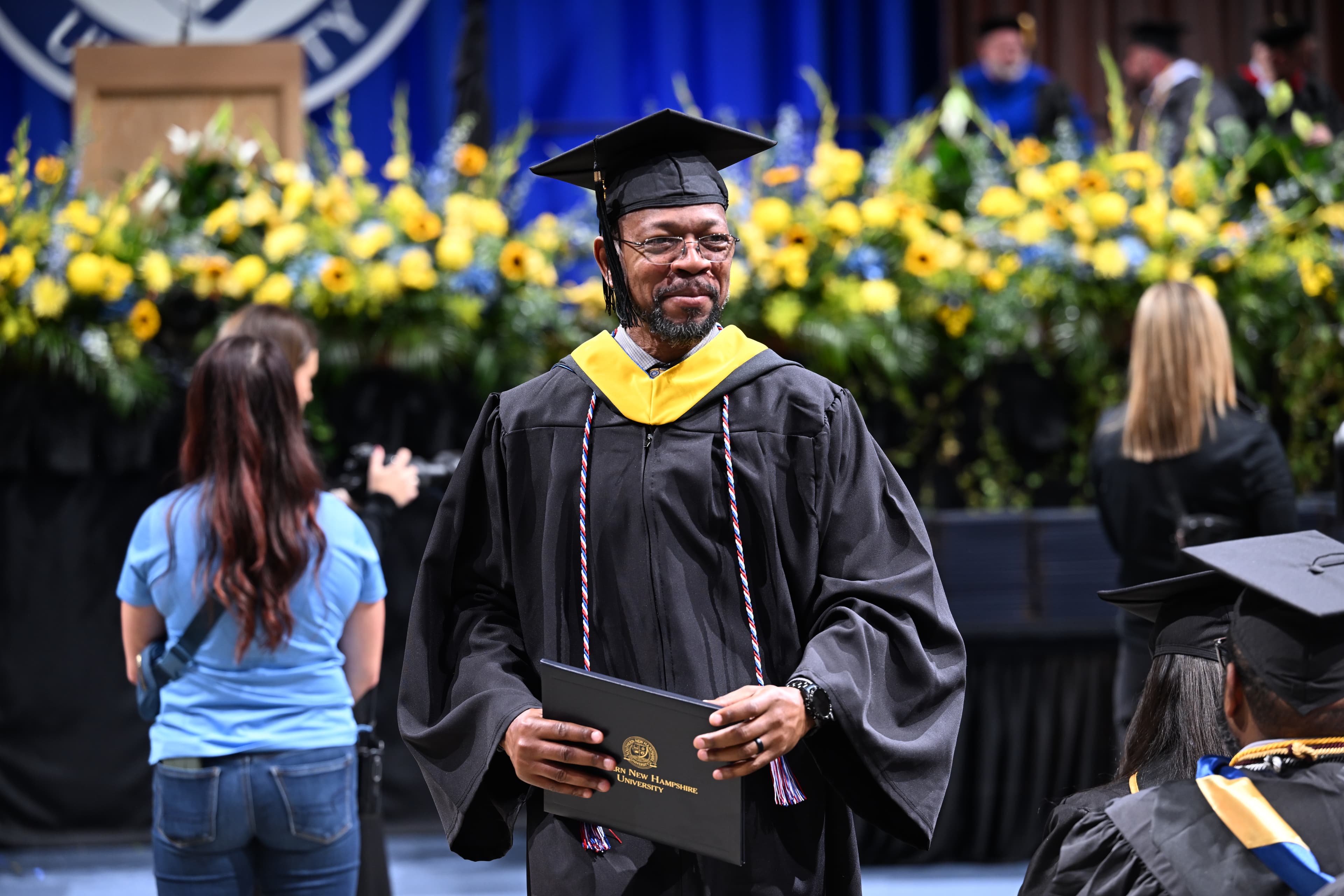 SNHU graduate in academic regalia